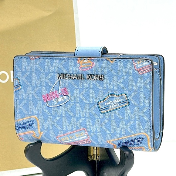 Michael Kors Handbags - Michael Kors Jet Set Travel Medium Printed Signature Logo Bi-Fold Wallet
LT SKY
